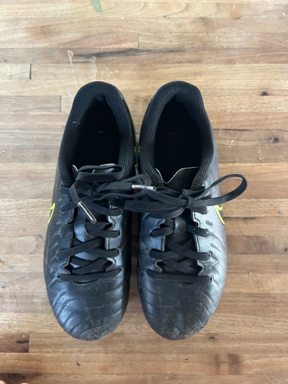 Nike Kids Black Soccer Cleats with Neon Yellow Swoosh